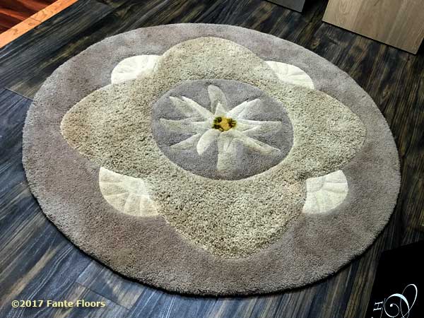 Custom cut lotus blossom area rug by Fante
