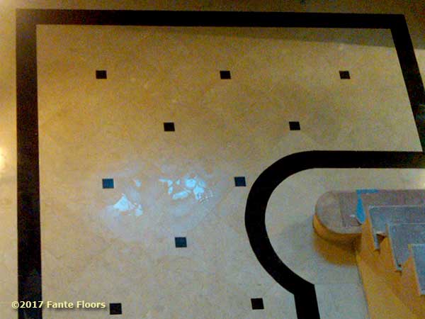 Tile floor entry way by Fante Flooring.